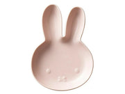 Pink bunny-shaped dish on a white background