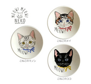 Set of three ceramic plates with cat illustrations and 'MEOW!' text, featuring the brand 'NEKO Design Japan'.