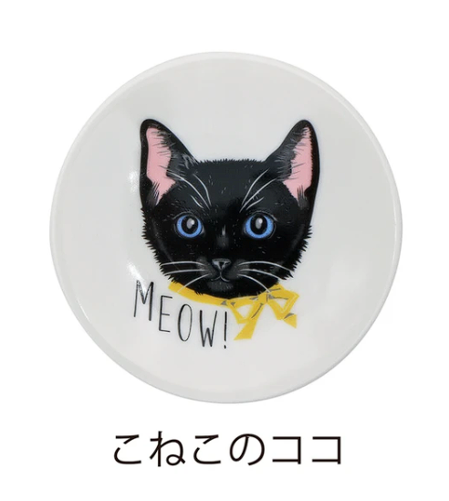 Round white object with a black cat illustration and 'MEOW!' text on a white background