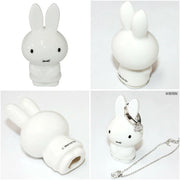 Collage of a white rabbit-shaped product with different angles and uses.