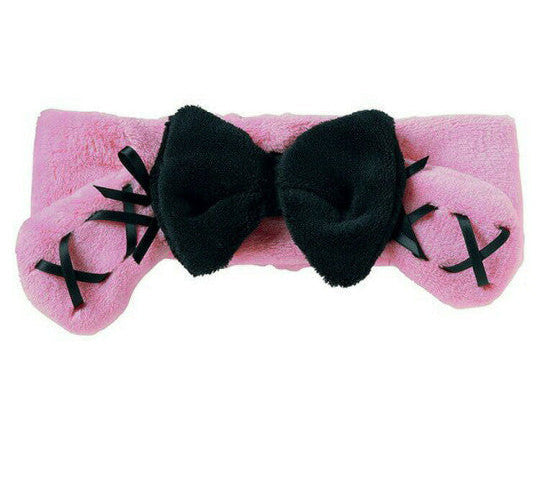 Pink headband with black bows on a white background